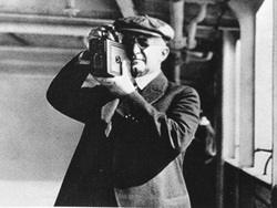 George Eastman holding one of his first Kodaks