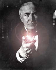 Thomas Edison and one of his light bulbs